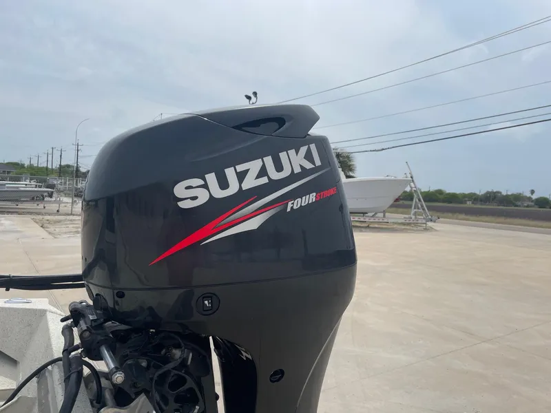 Slide: The Image of Suzuki four-stroke outboard motor on 2017 Alumacraft 1860 BAY CC TUNNEL boat. - 9