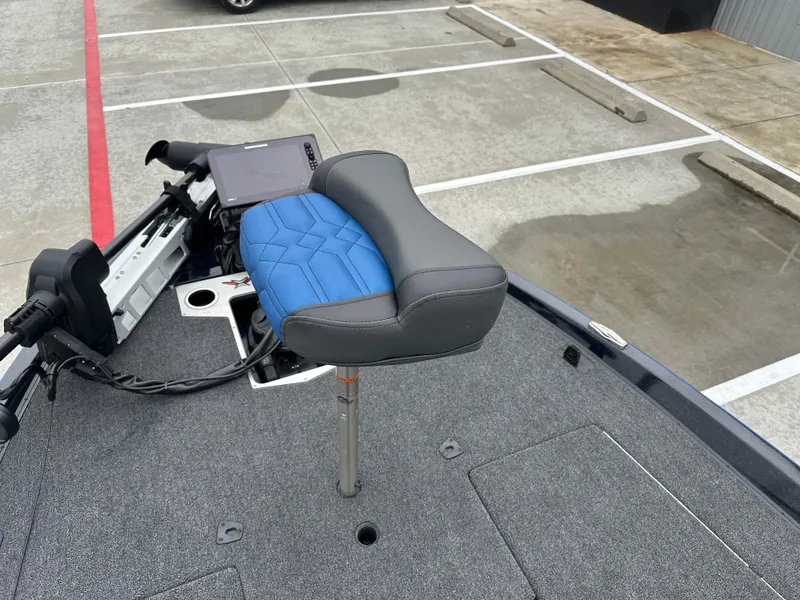 Slide: The Image of 2025 Vexus VXS21 boat with blue and gray seat on deck. - 11