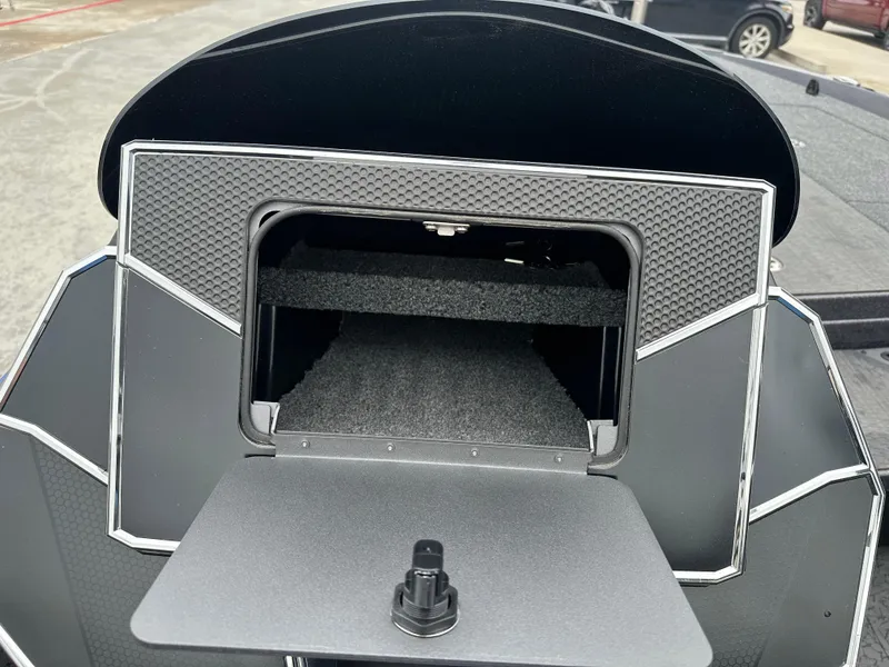 Slide: The Image of 2025 Vexus VXS21 boat storage compartment with open hatch, showcasing interior space. - 14