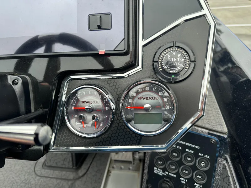 Slide: The Image of 2025 Vexus VXS21 dashboard with speedometer, lift plate gauge, and control panel. - 17