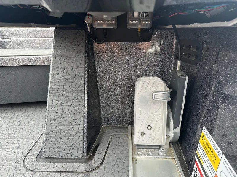 Slide: The Image of Interior view of a 2025 Vexus VXS21 boat, showcasing foot pedal and wiring. - 20