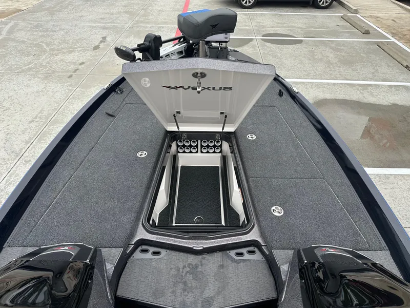 Slide: The Image of 2025 Vexus VXS21 boat with open storage compartment, parked in a lot. - 5