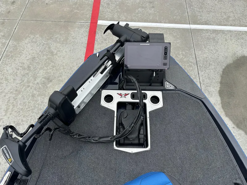 Slide: The Image of 2025 Vexus VXS21 boat deck with trolling motor and fishfinder. - 9