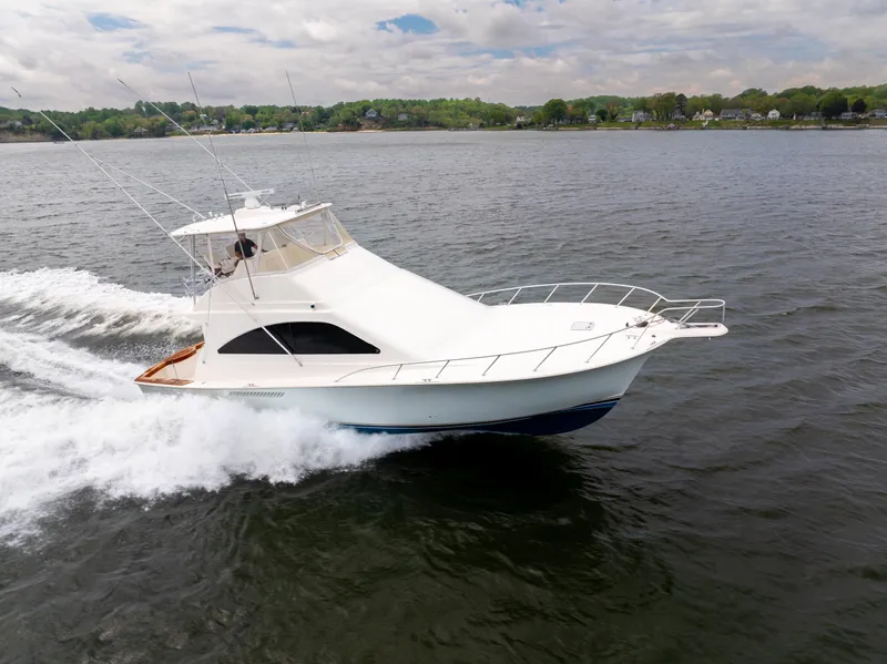 Slide: The Image of 2004 Ocean Yachts 50 Super Sport cruising on open water. - 0