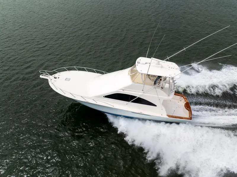 Slide: The Image of 2004 Ocean Yachts 50 Super Sport cruising on open water. - 1