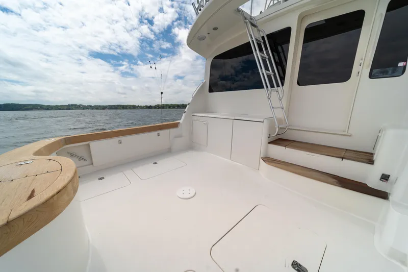 Slide: The Image of 2004 Ocean Yachts 50 Super Sport boat deck with ocean view and clear sky. - 12