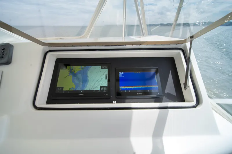 Slide: The Image of Control panel of 2004 Ocean Yachts 50 Super Sport with navigation screens. - 16