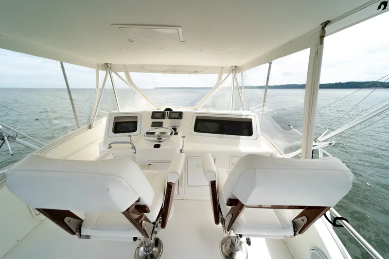 Slide: The Image of 2004 Ocean Yachts 50 Super Sport yacht helm with dual seats and ocean view. - 19