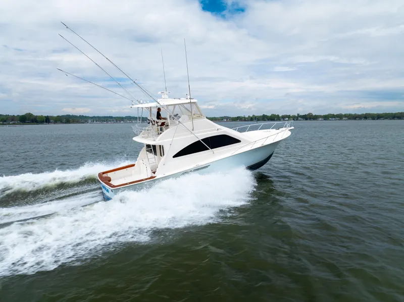 Slide: The Image of 2004 Ocean Yachts 50 Super Sport cruising on open water. - 2