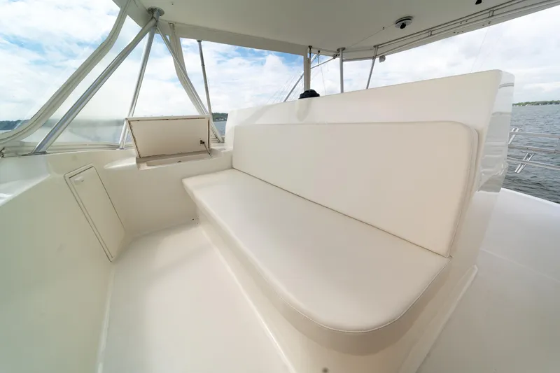 Slide: The Image of 2004 Ocean Yachts 50 Super Sport boat with white seating on deck. - 20
