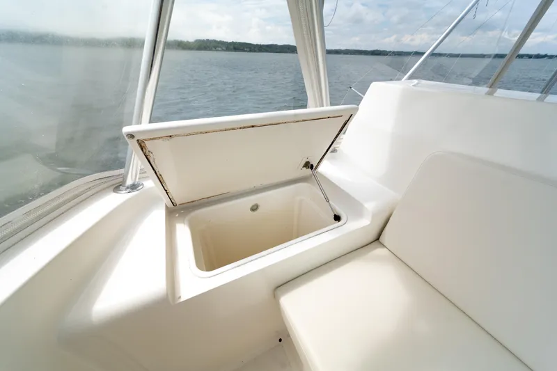 Slide: The Image of 2004 Ocean Yachts 50 Super Sport interior with open storage compartment, overlooking water. - 21