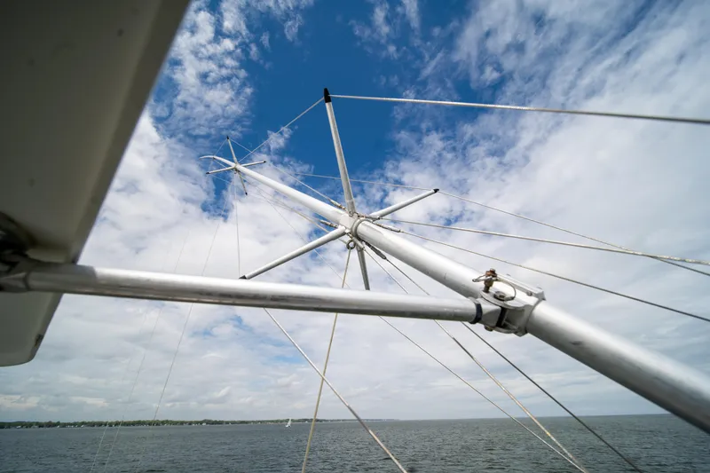 Slide: The Image of Mast of 2004 Ocean Yachts 50 Super Sport against blue sky and ocean backdrop. - 23