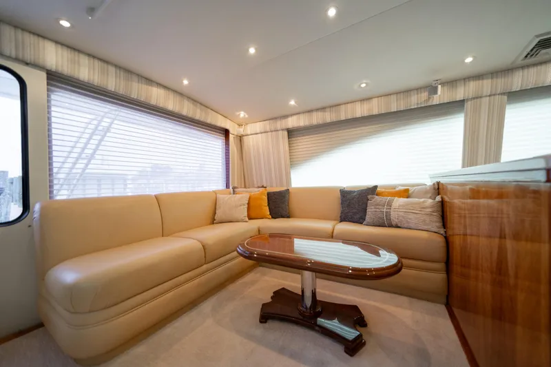 Slide: The Image of Luxurious interior of 2004 Ocean Yachts 50 Super Sport with plush seating and elegant table. - 25