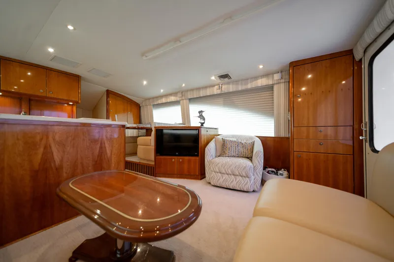 Slide: The Image of Luxurious interior of a 2004 Ocean Yachts 50 Super Sport with elegant wood finishes. - 26