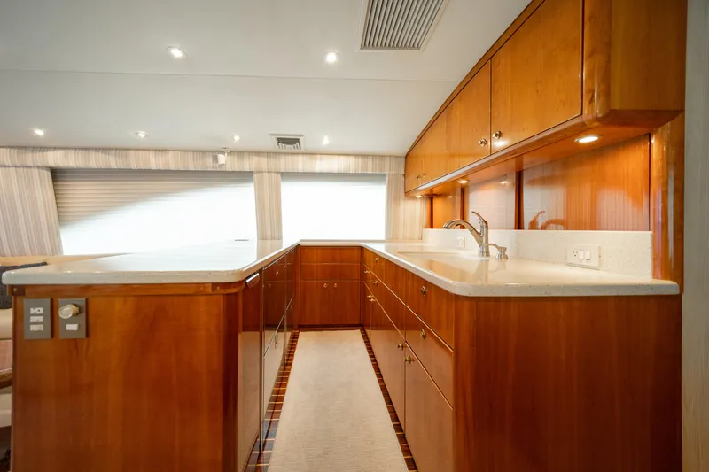 Slide: The Image of Luxurious kitchen interior of 2004 Ocean Yachts 50 Super Sport with wooden cabinetry. - 30