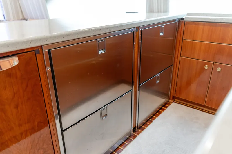 Slide: The Image of 2004 Ocean Yachts 50 Super Sport yacht interior with stainless steel appliances and wooden cabinetry. - 33