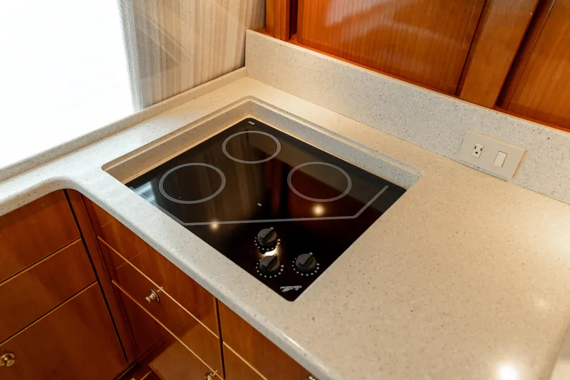 Slide: The Image of Modern kitchen cooktop on 2004 Ocean Yachts 50 Super Sport. - 35
