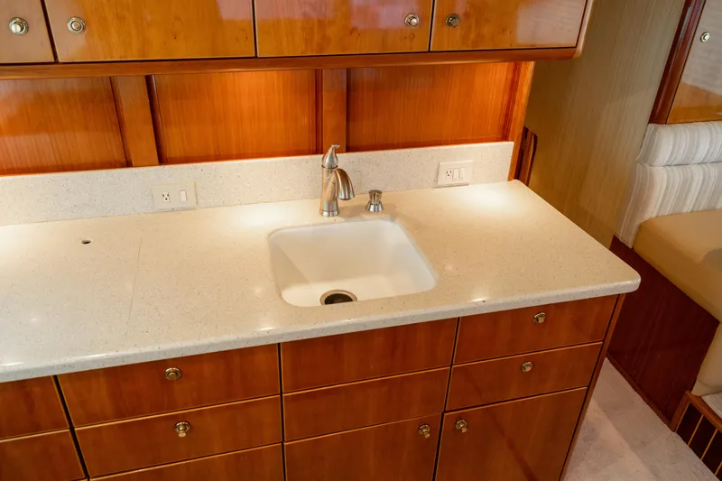 Slide: The Image of Luxurious kitchen sink area on 2004 Ocean Yachts 50 Super Sport. - 36