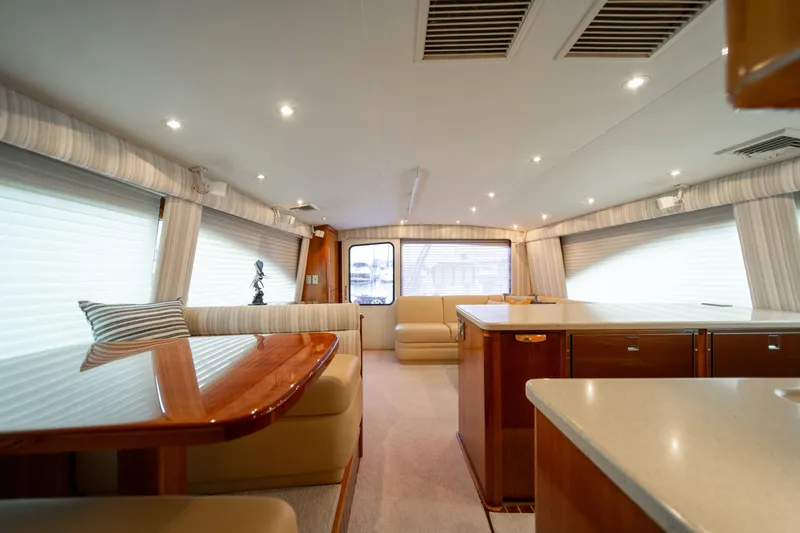 Slide: The Image of Luxurious interior of 2004 Ocean Yachts 50 Super Sport with elegant seating and dining area. - 37