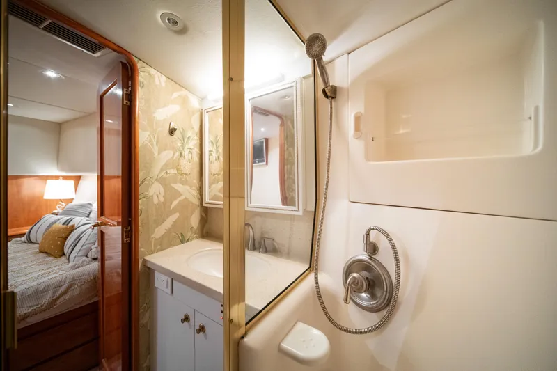 Slide: The Image of Bathroom and bedroom interior of 2004 Ocean Yachts 50 Super Sport. - 47
