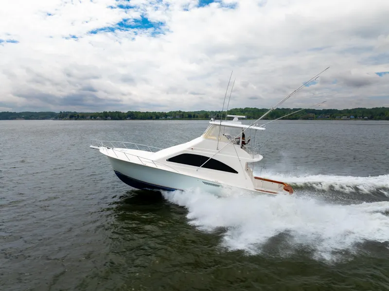 Slide: The Image of 2004 Ocean Yachts 50 Super Sport cruising on a lake under a cloudy sky. - 5