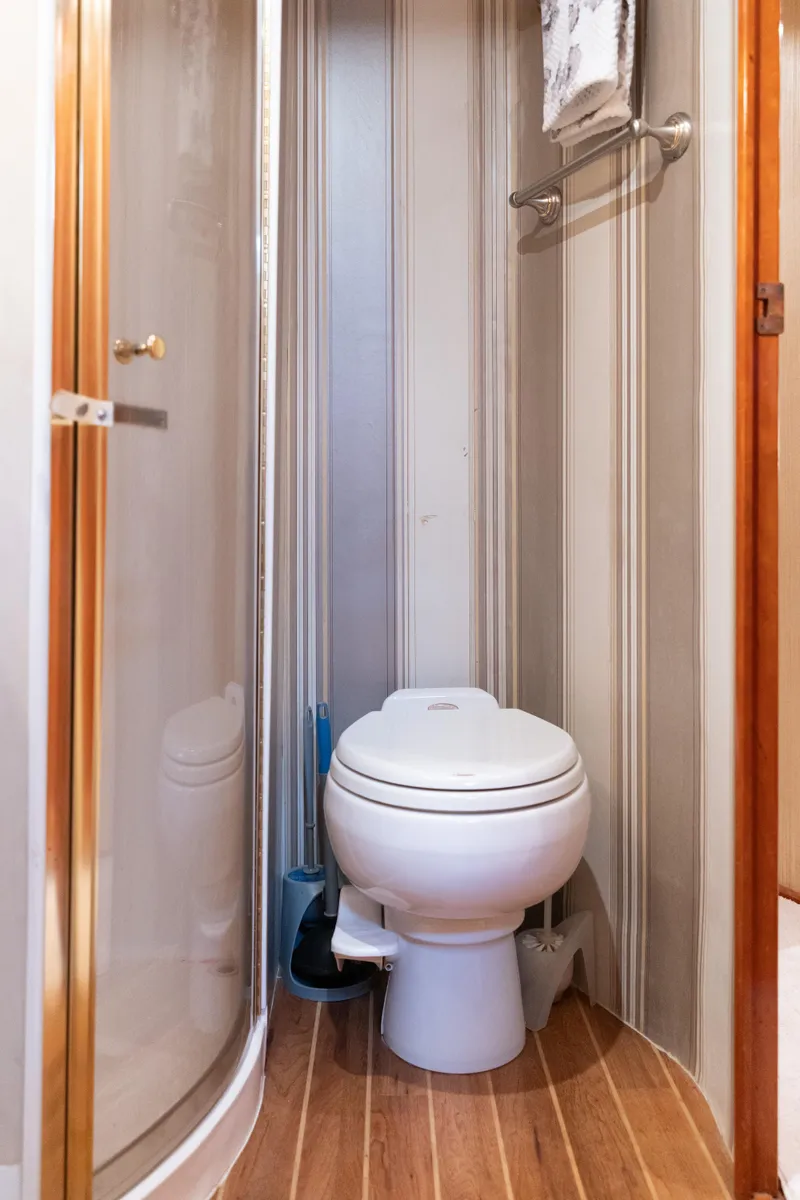 Slide: The Image of Compact bathroom in 2004 Ocean Yachts 50 Super Sport with shower and toilet. - 50