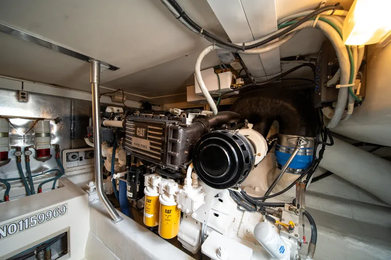 Slide: The Image of Engine room of a 2004 Ocean Yachts 50 Super Sport, featuring a CAT engine. - 55