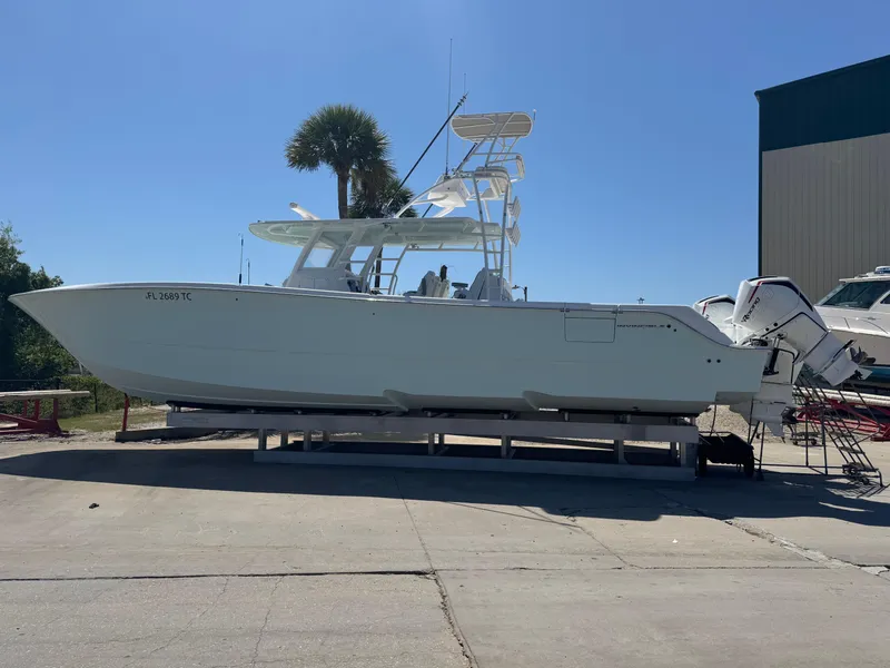 The Image of 2022 Invincible 46 Catamaran on display, side view, outdoors, clear sky. - 1