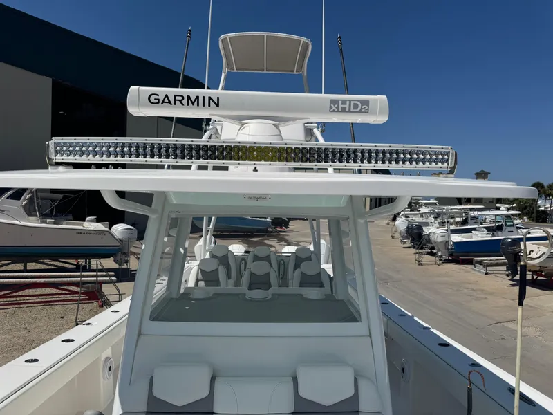 Slide: The Image of 2022 Invincible 46 Catamaran with Garmin xHD2 radar, docked in a marina. - 16