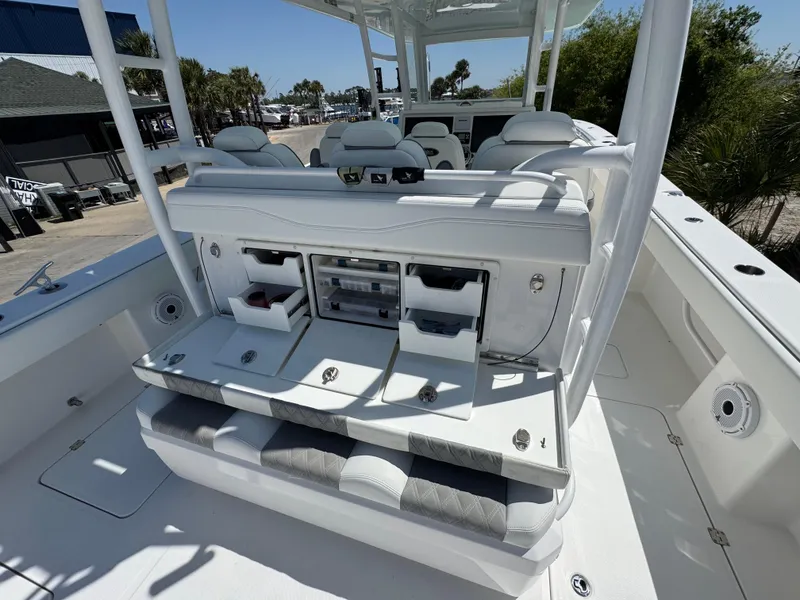Slide: The Image of 2022 Invincible 46 Catamaran interior with seating and storage compartments. - 5