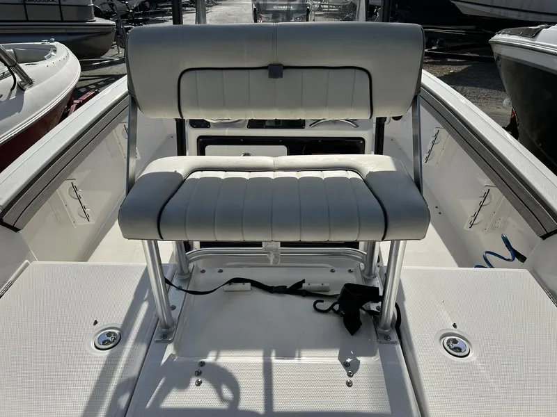 Slide: The Image of 2021 Yamaha Boats 195 FSH Sport interior with cushioned seating and sleek design. - 5