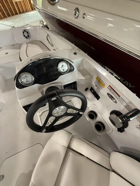 Slide: The Image of 2025 Stingray 182SC boat dashboard with steering wheel and gauges. - 16
