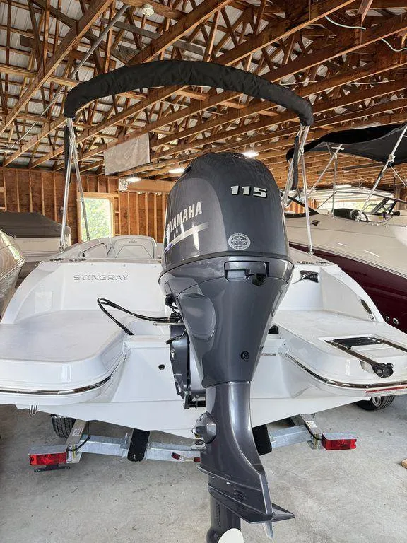 Slide: The Image of 2025 Stingray 182SC boat with Yamaha 115 engine in a wooden boathouse. - 5
