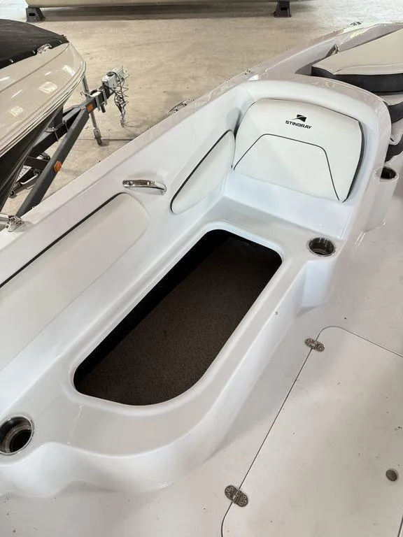 Slide: The Image of 2025 Stingray 182SC boat interior with seating and storage compartment. - 9