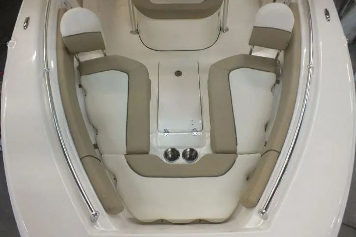 Slide: The Image of 2023 Key West 239 FS boat interior with beige seating and cup holders. - 3