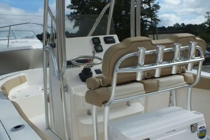 Slide: The Image of 2023 Key West 239 FS boat interior with helm, seating, and console controls. - 7