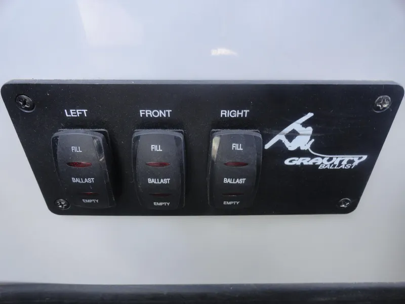 Slide: The Image of 2011 Moomba Outback V ballast control panel with fill and empty switches. - 10
