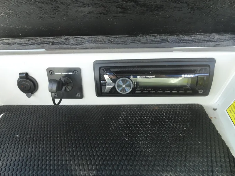 Slide: The Image of 2011 Moomba Outback V dashboard with Sony stereo system and auxiliary input. - 15