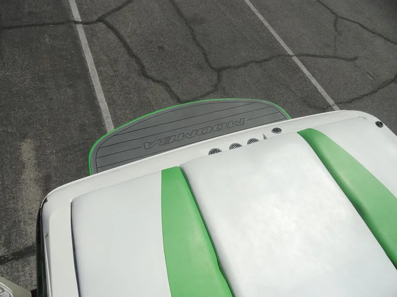Slide: The Image of 2011 Moomba Outback V boat with green and white upholstery, viewed from above. - 18