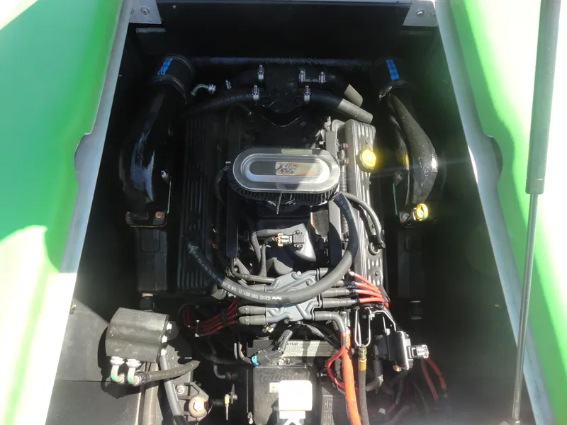 Slide: The Image of 2011 Moomba Outback V engine compartment with visible components and wiring. - 19