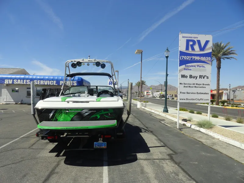 Slide: The Image of 2011 Moomba Outback V boat parked near RV sales and service center. - 21