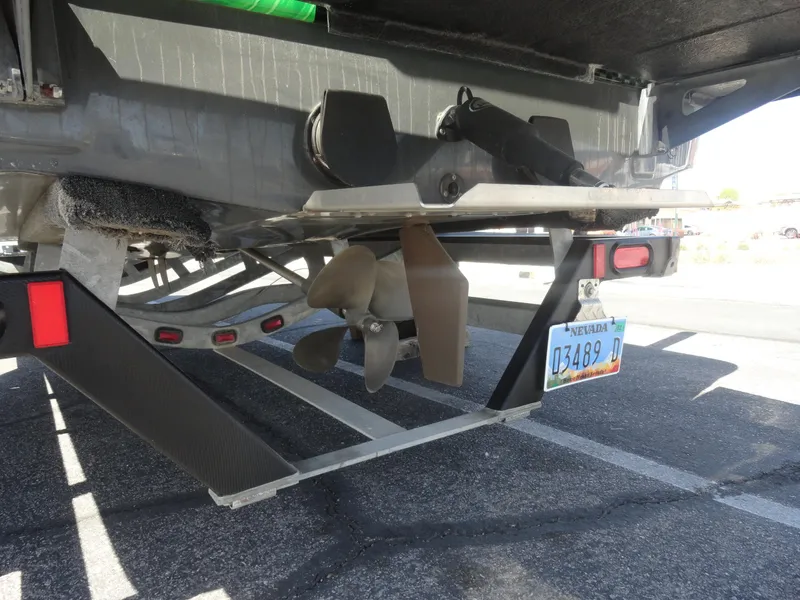 Slide: The Image of 2011 Moomba Outback V boat trailer with visible propeller and license plate. - 22