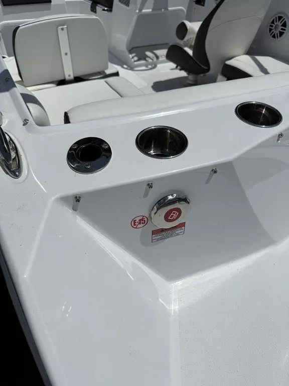 Slide: The Image of 2025 Stingray 172SC boat interior with cup holders and seating. - 12