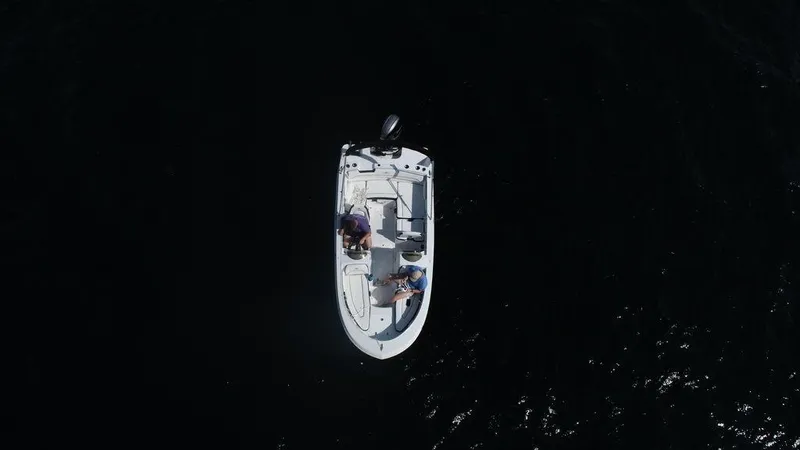 Slide: The Image of Aerial view of 2025 Stingray 172SC boat on dark water. - 13