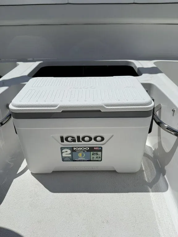 Slide: The Image of Igloo cooler on 2025 Stingray 172SC boat deck in sunlight. - 15