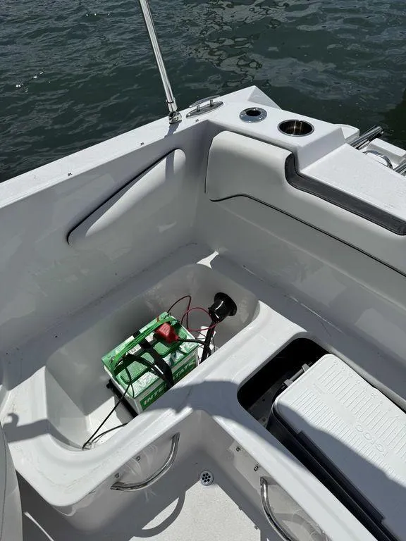 Slide: The Image of 2025 Stingray 172SC boat interior with battery compartment and cup holders. - 16