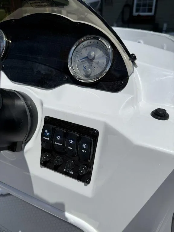 Slide: The Image of Dashboard of a 2025 Stingray 172SC boat with gauges and control panel. - 22