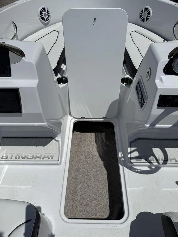 Slide: The Image of 2025 Stingray 172SC boat interior with seating and storage compartments. - 23