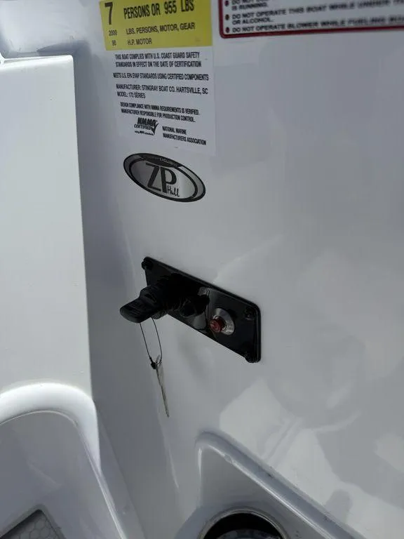 Slide: The Image of Control panel of a 2025 Stingray 172SC boat with safety instructions and key. - 25