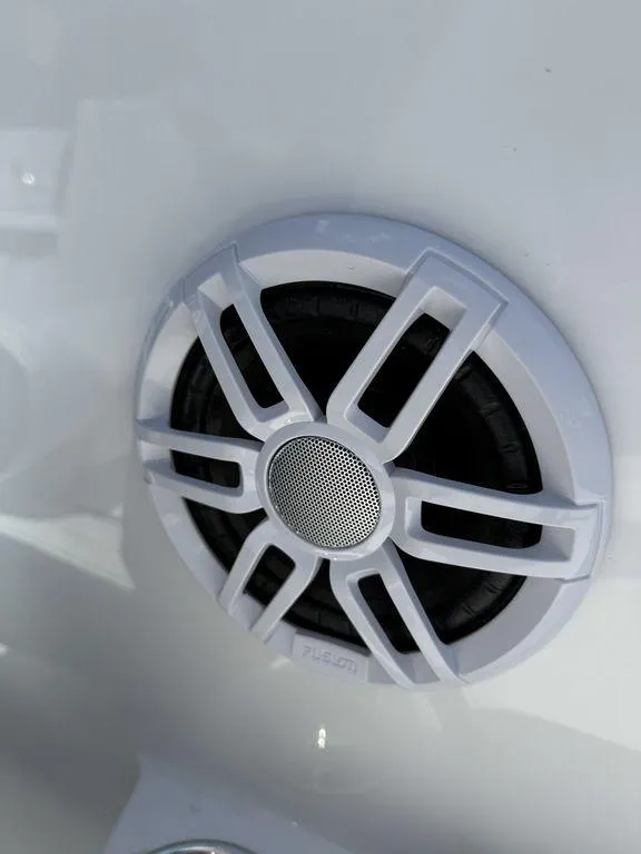 Slide: The Image of Close-up of a white speaker on a 2025 Stingray 172SC boat. - 26